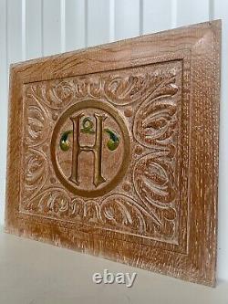 A Stunning Carved Panel in oak with the letter H