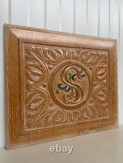 A Stunning Carved Panel in oak with the letter S