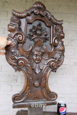 Antique black forest wood carved panel caryatid angel backrest chair