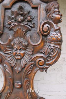 Antique black forest wood carved panel caryatid angel backrest chair