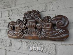 Antique wood carved putti cherub figural wall plaque panel