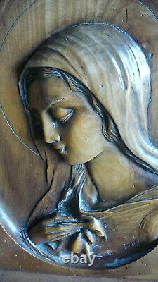 Carved Wood Panel of st mary signed bastian