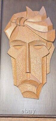 Mid-Century Carved Wood Relief Mask Wall Sculpture Panel, a pair, circa 1960