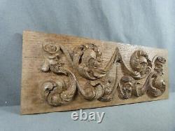 Renaissance-style carved oak bas-relief decorated with 4 grotesque heads